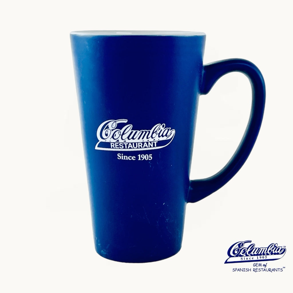 Coffee Mug Blue with handle and white columbia logo on it