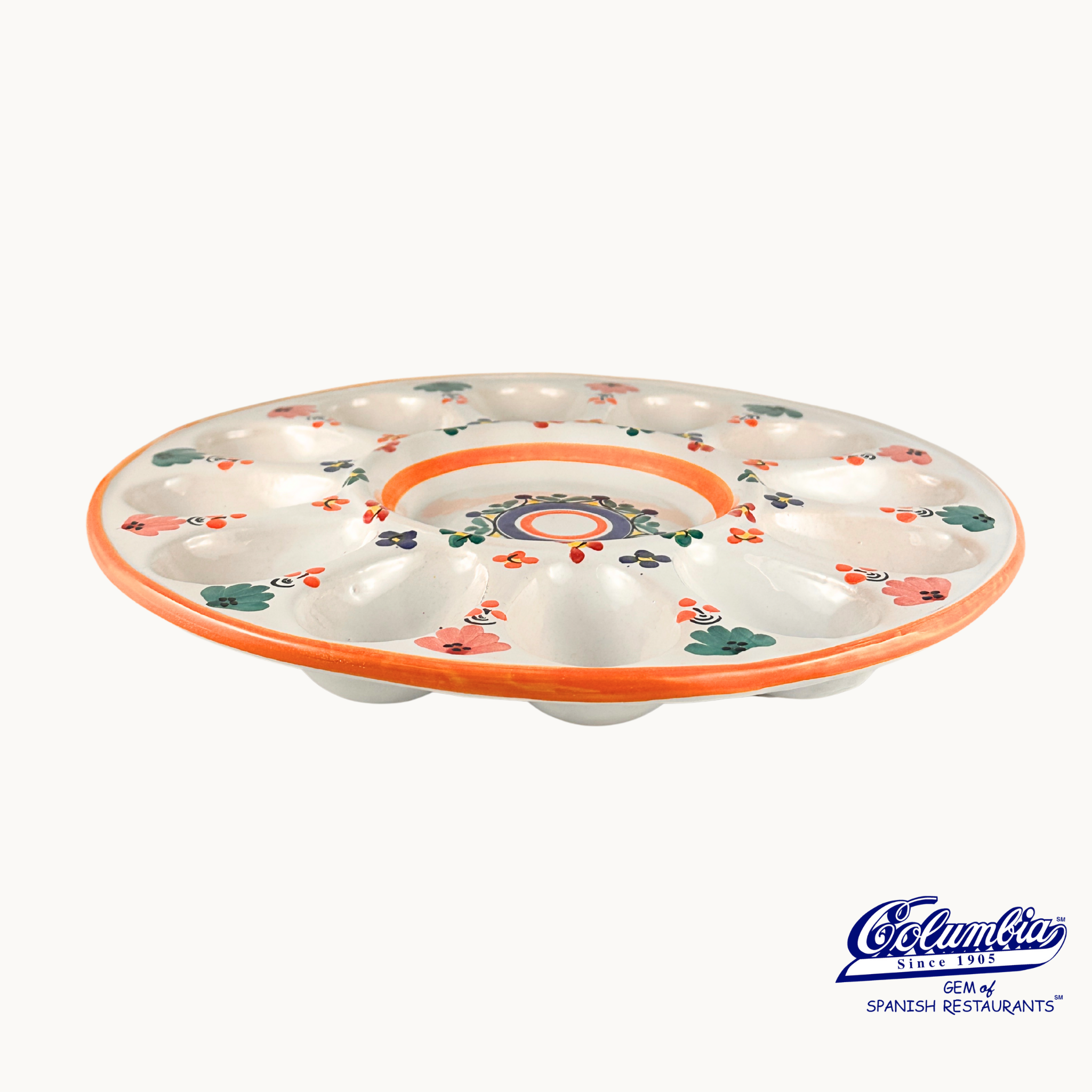 Decorative ceramic egg tray with floral patterns on a white background, featuring the Coquimbo brand.