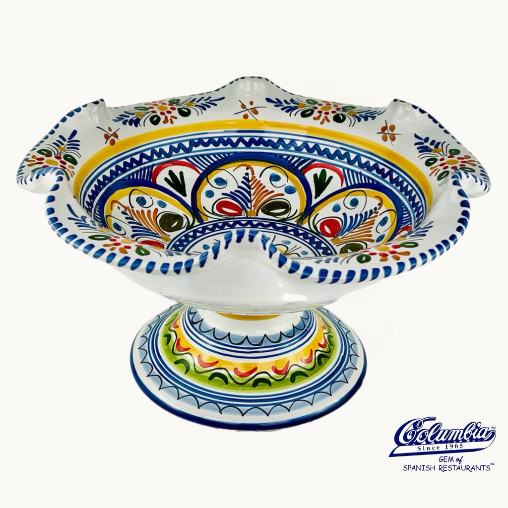 Decorative ceramic bowl with colorful patterns on a white background