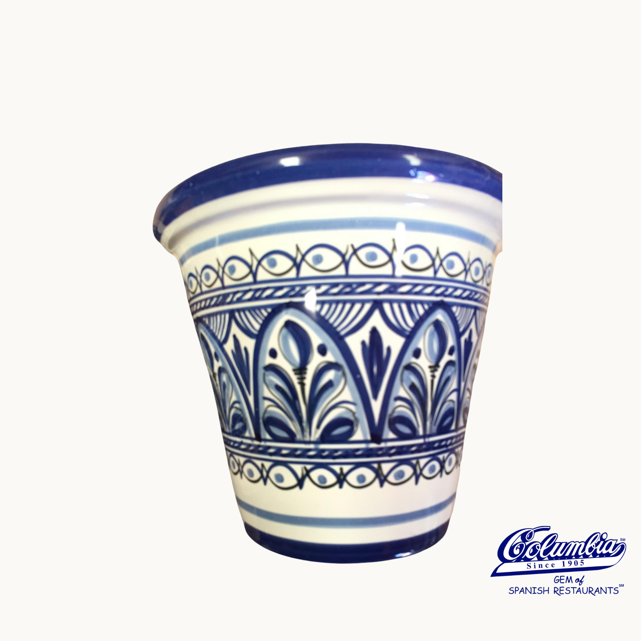 Decorative blue and white ceramic pot on a white background