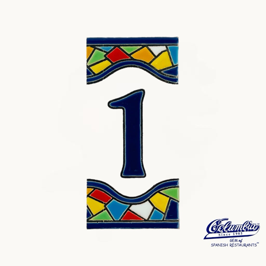 Colorful ceramic tile with the number '1' on a white background, featuring the Columba logo.