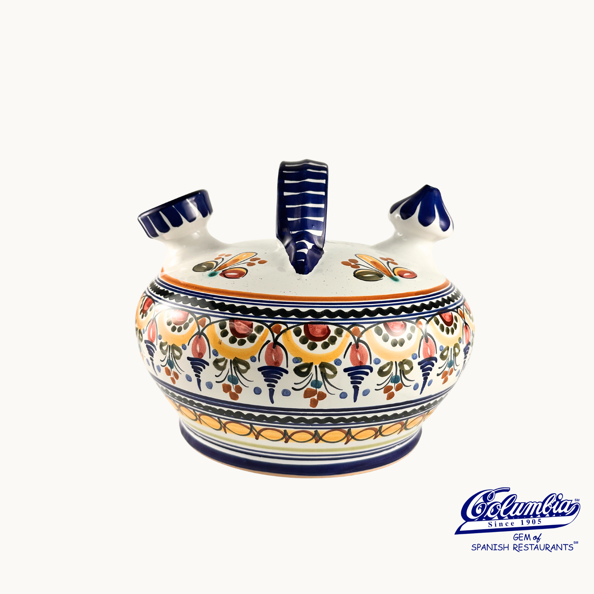 Decorative ceramic pot with colorful patterns on a white background, featuring the Columba brand.