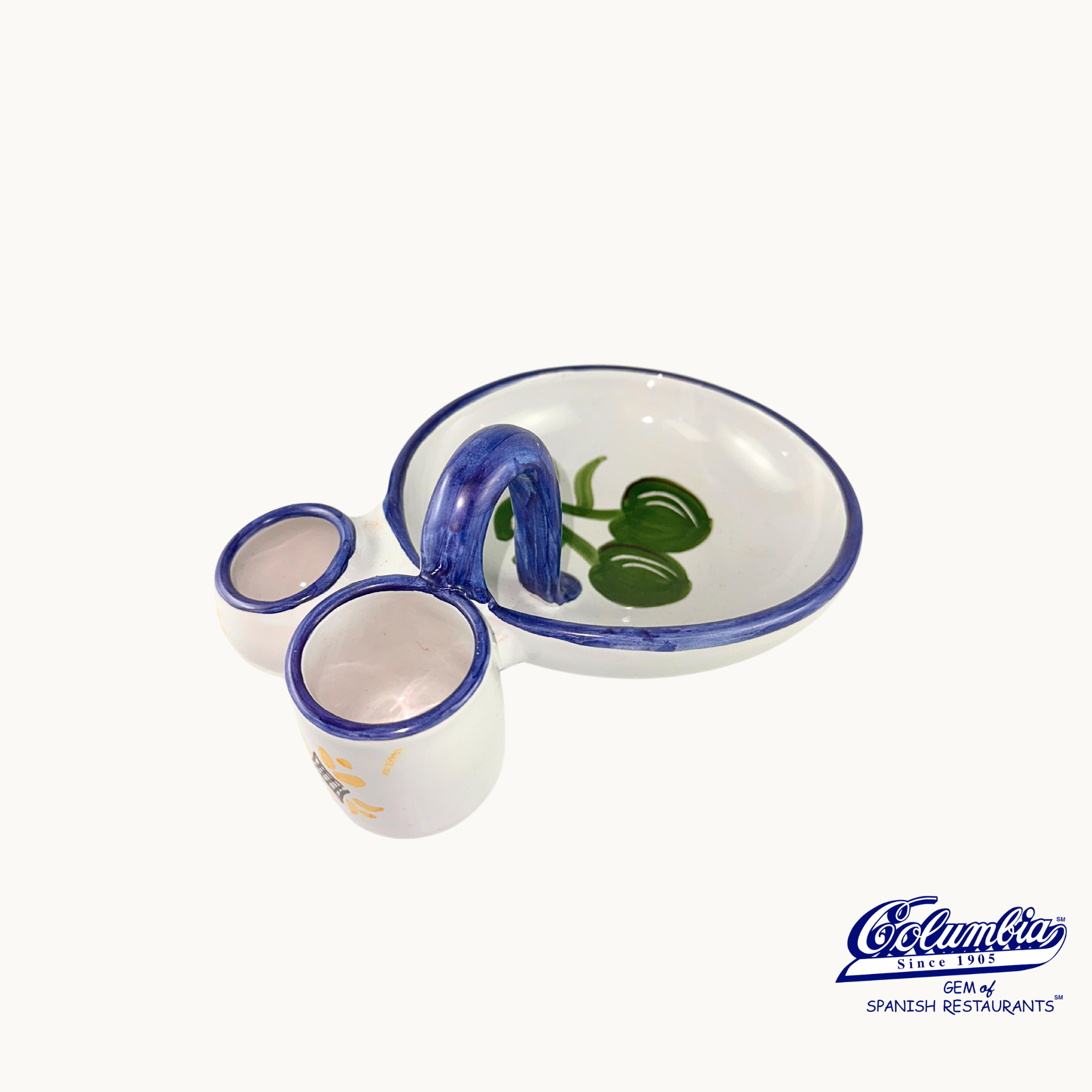 Ceramic set with cups and a bowl featuring blue and green designs on a white background.