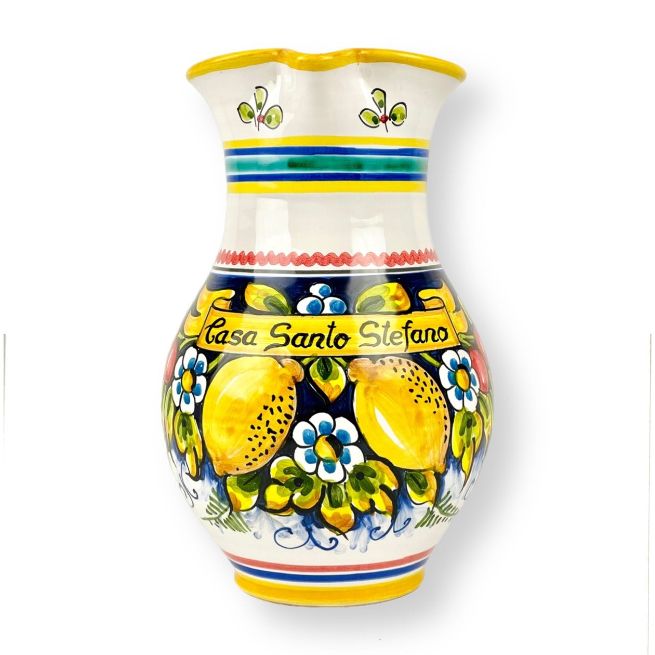 A hand-painted, ceramic large pitcher with floral and fruit patterns, predominantly yellow and white, with the text 'Casa Santo Stefano' on it.