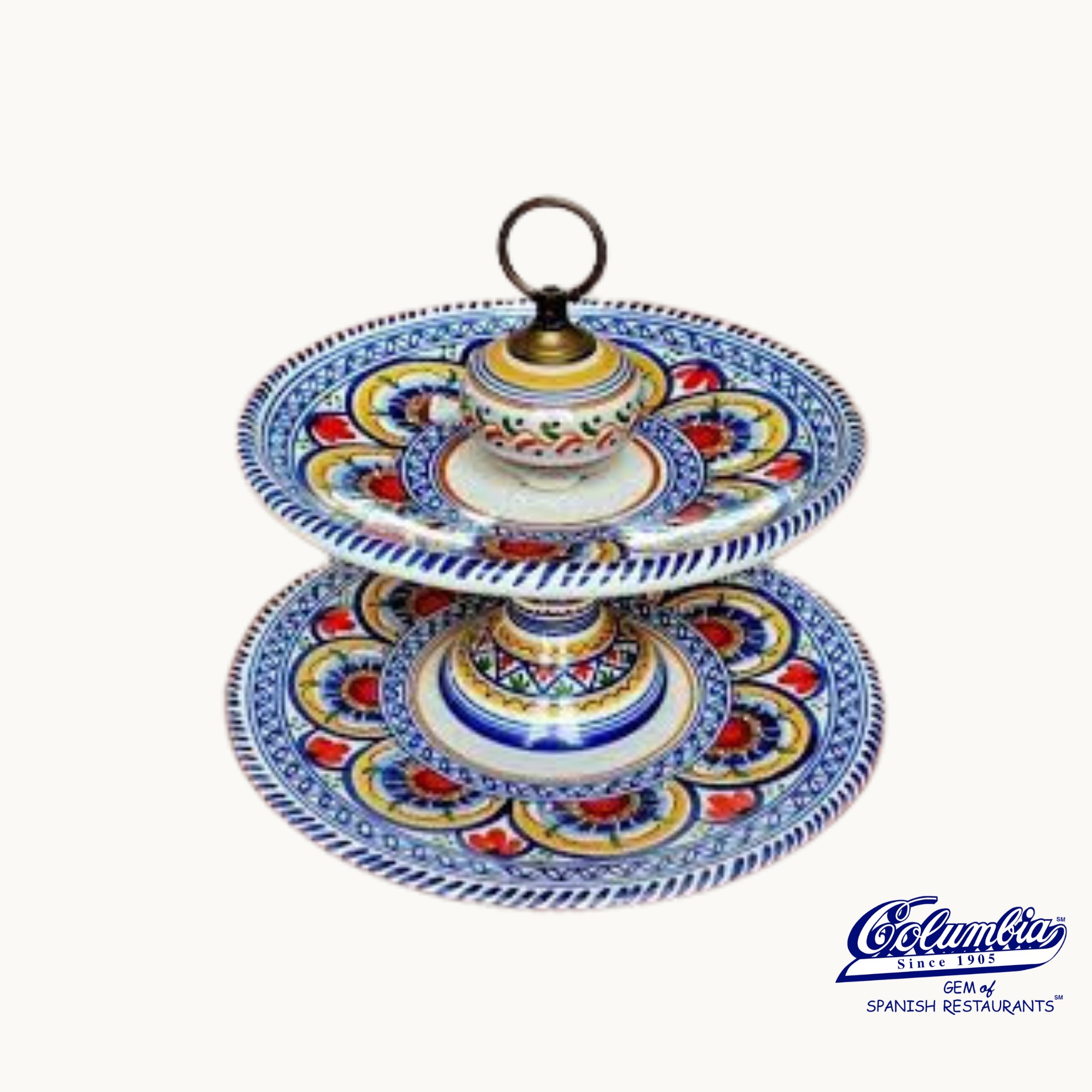 A hand made, two-tier serving platter with bright and bold floral and geometric patterns, made of ceramic and originating from Talavera, Spain.