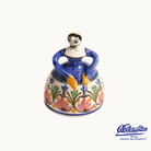 Ceramic bell with colorful designs on a white background