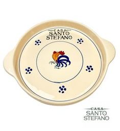 A beige ceramic serving tray with blue floral patterns and a colorful rooster in the center, along with the text 'CASA SANTO STEFANO'.