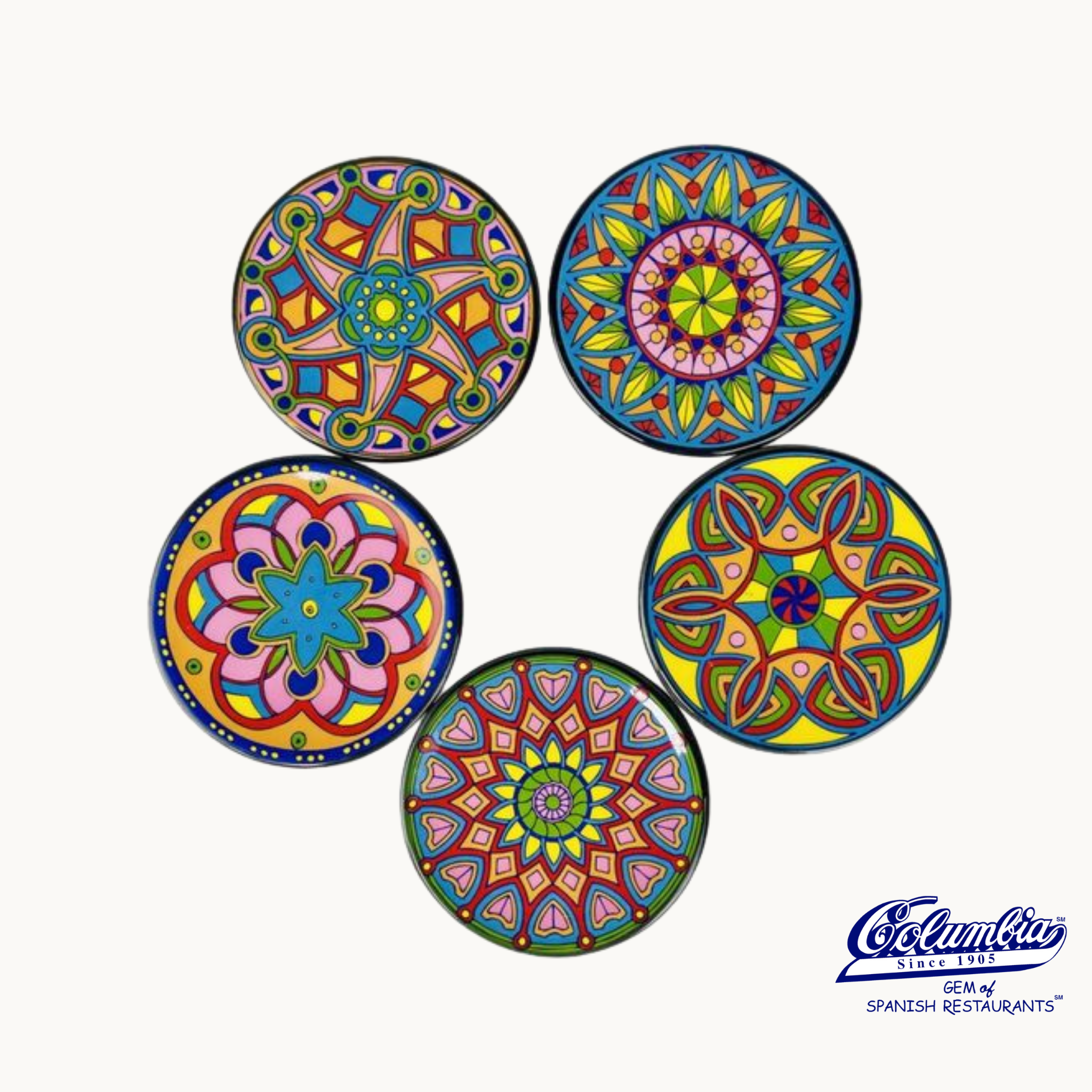 A set of five colorful ceramic coasters with ornate patterns, each 4 inches in diameter, along with the brand logo 'Cámara'.
