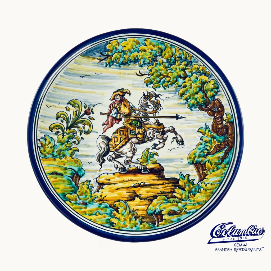 Decorative Plate with a man on a horse with a sword in a forrest. 