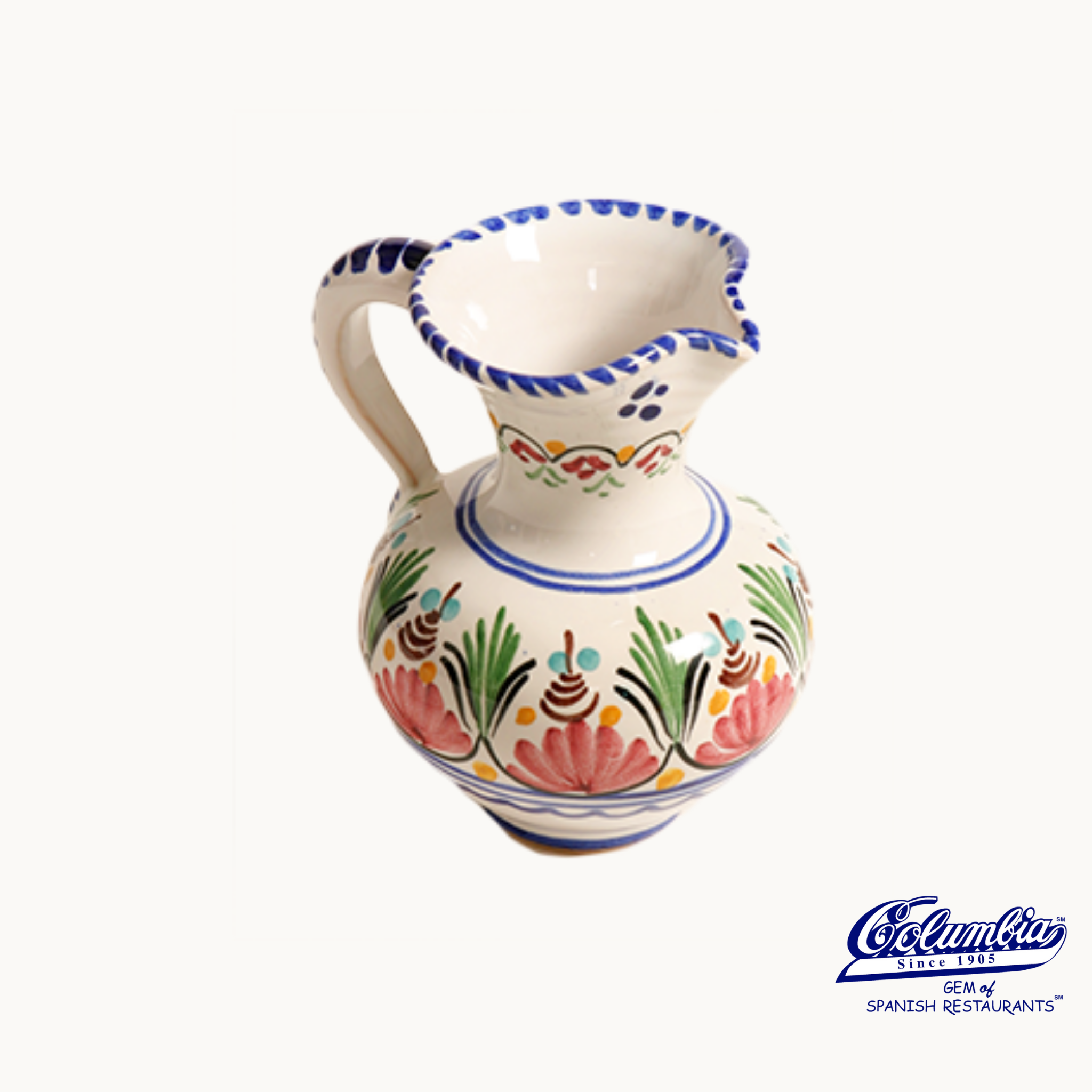 Decorative ceramic pitcher with colorful patterns on a white background