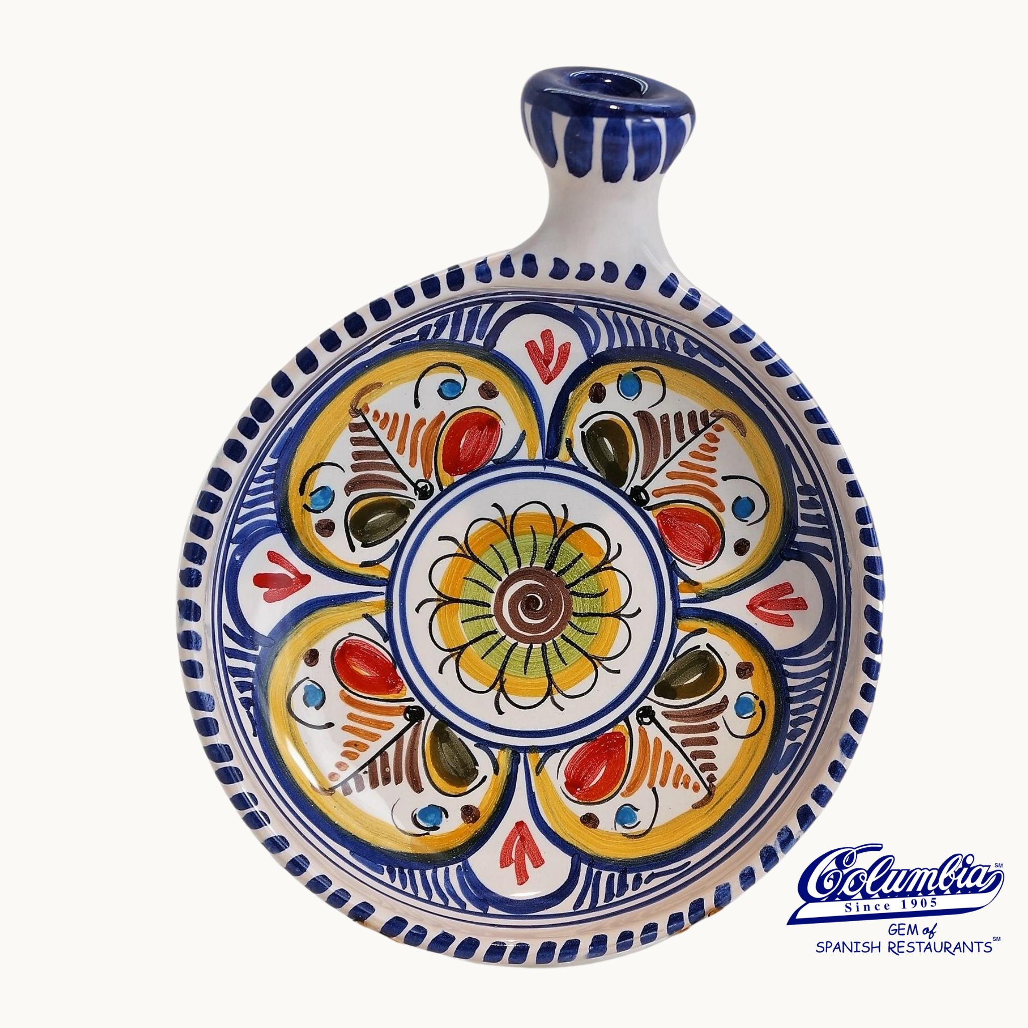 Colorful ceramic dish with intricate patterns on a white background
