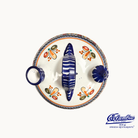 Ceramic dish with shell design and colorful floral patterns on a white background, featuring the Columba brand.
