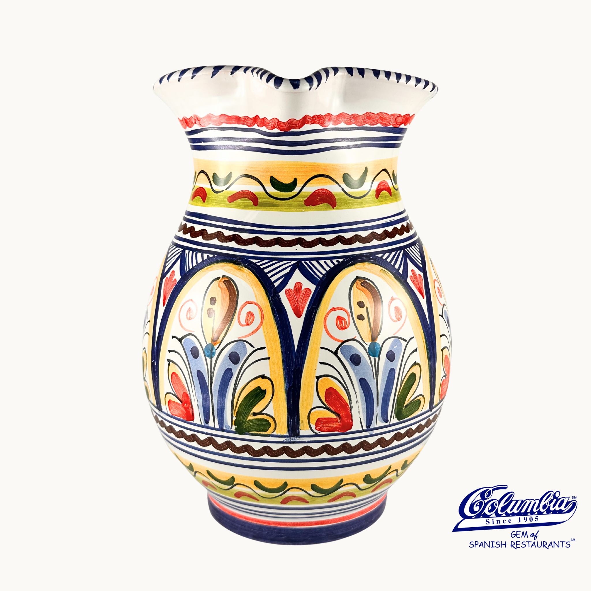 Colorful ceramic vase with decorative patterns on a white background, featuring the Columba brand.