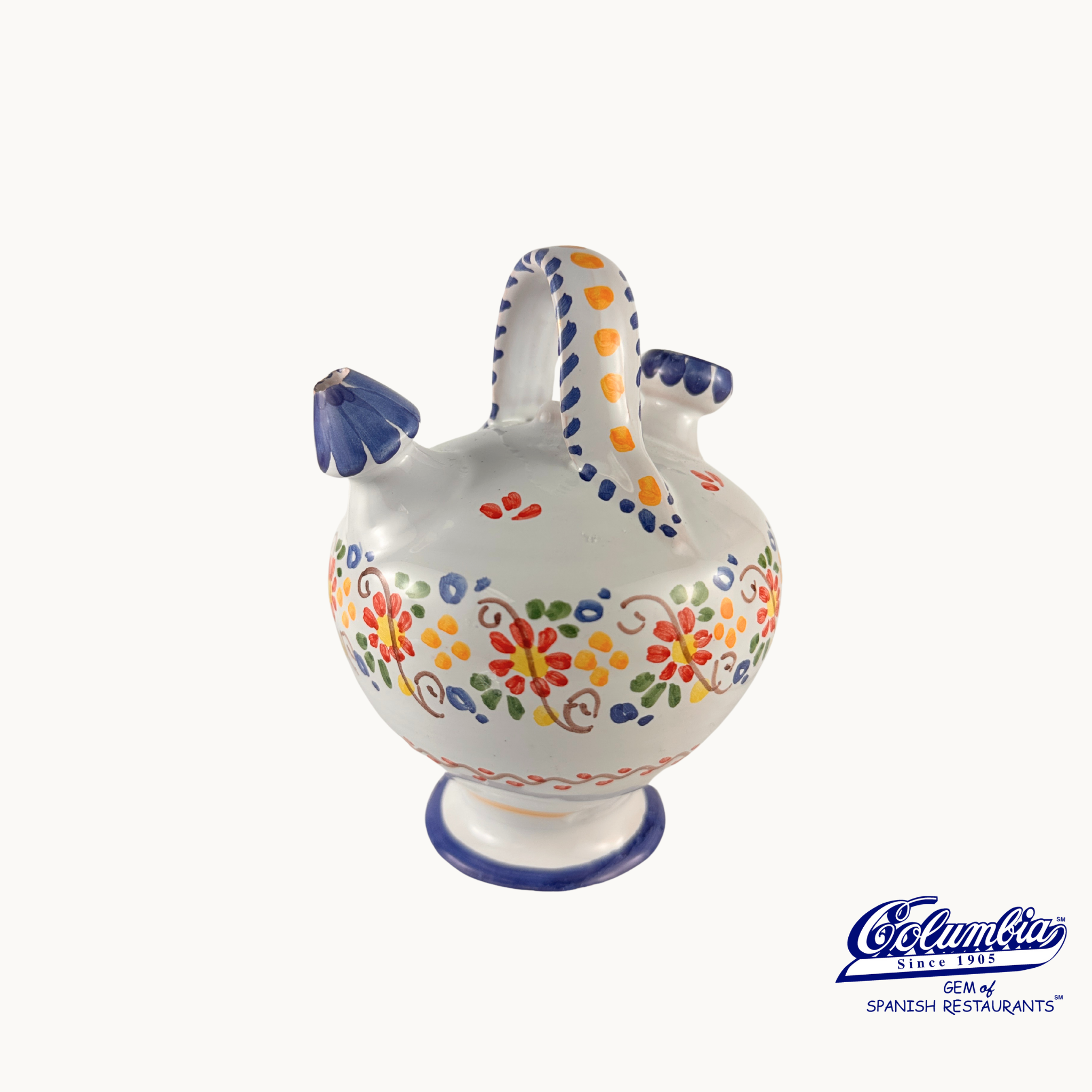 Decorative ceramic jar with colorful patterns on a white background, featuring the Columba brand.