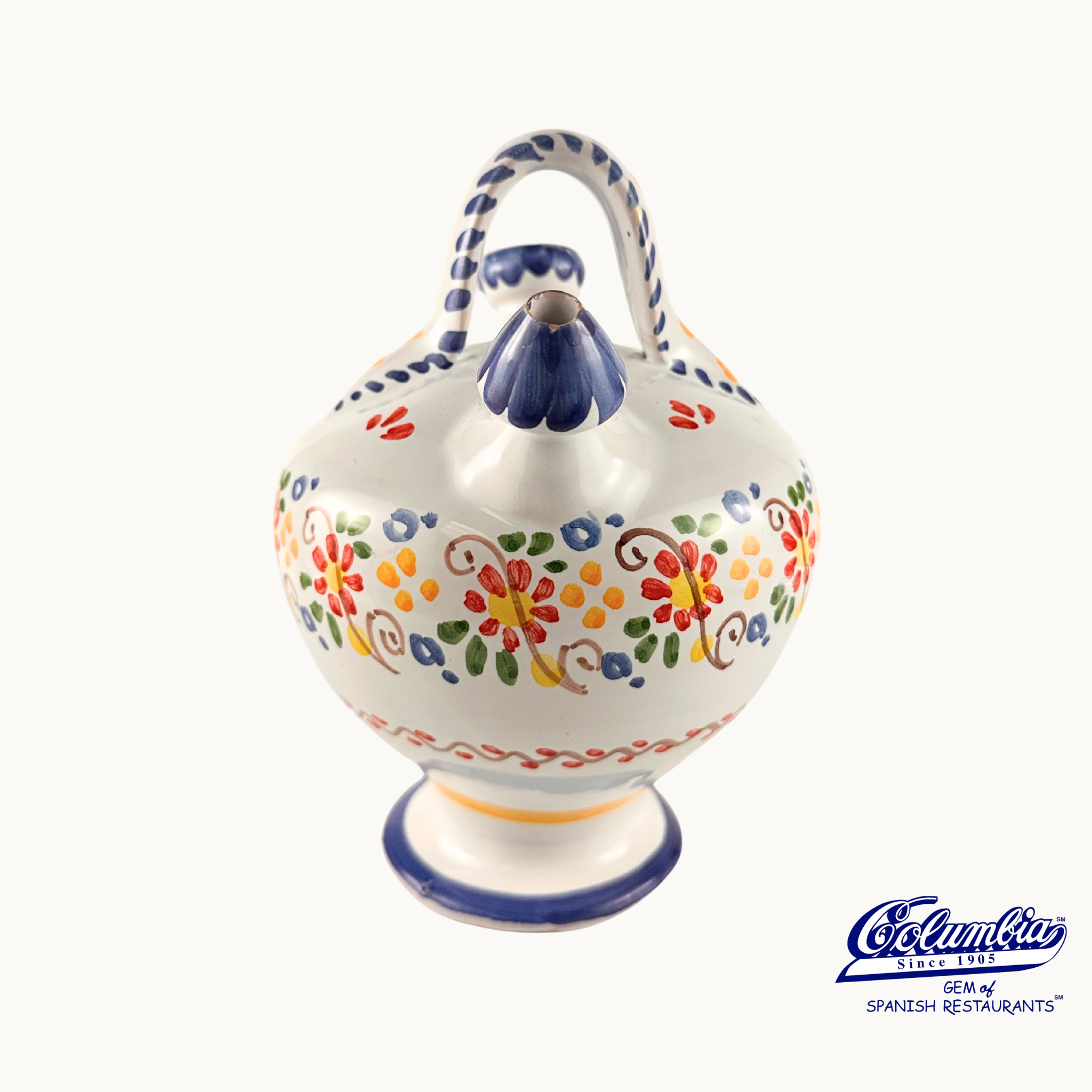 Decorative ceramic Botijo jar with colorful patterns on a white background, featuring the Columba brand.