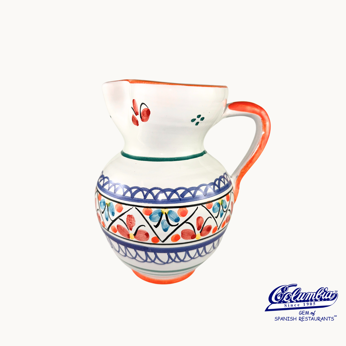 Decorative ceramic pitcher with colorful patterns on a white background, featuring the columbia logo.