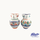 Two ceramic vases with colorful floral patterns on a white background, featuring the Columba brand.