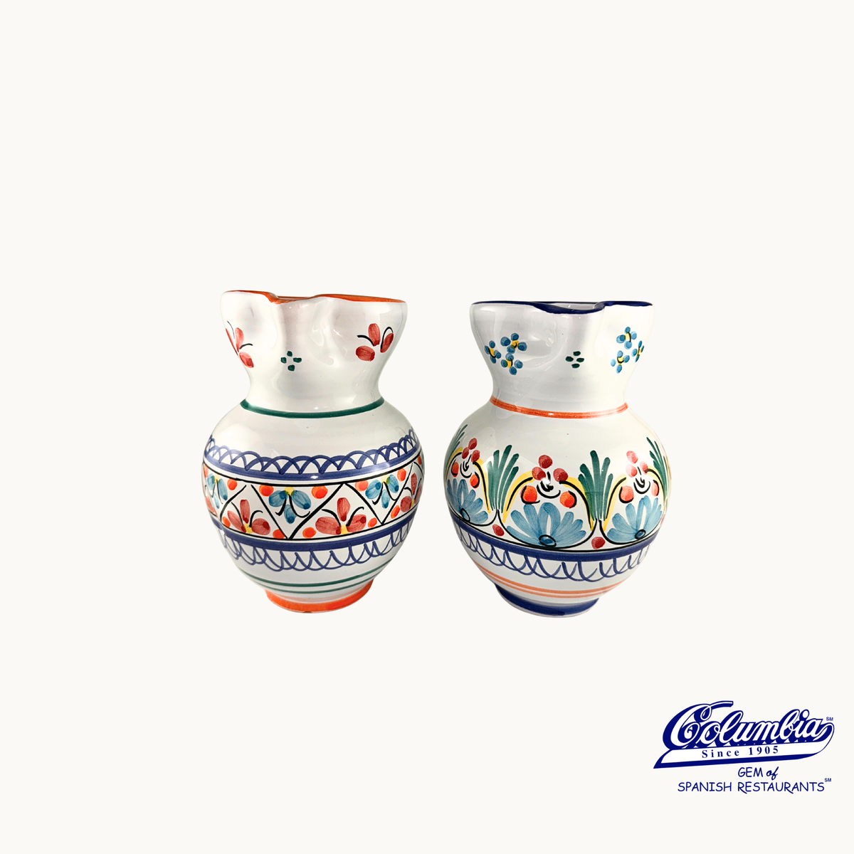 Two ceramic vases with colorful floral patterns on a white background, featuring the Columba brand.