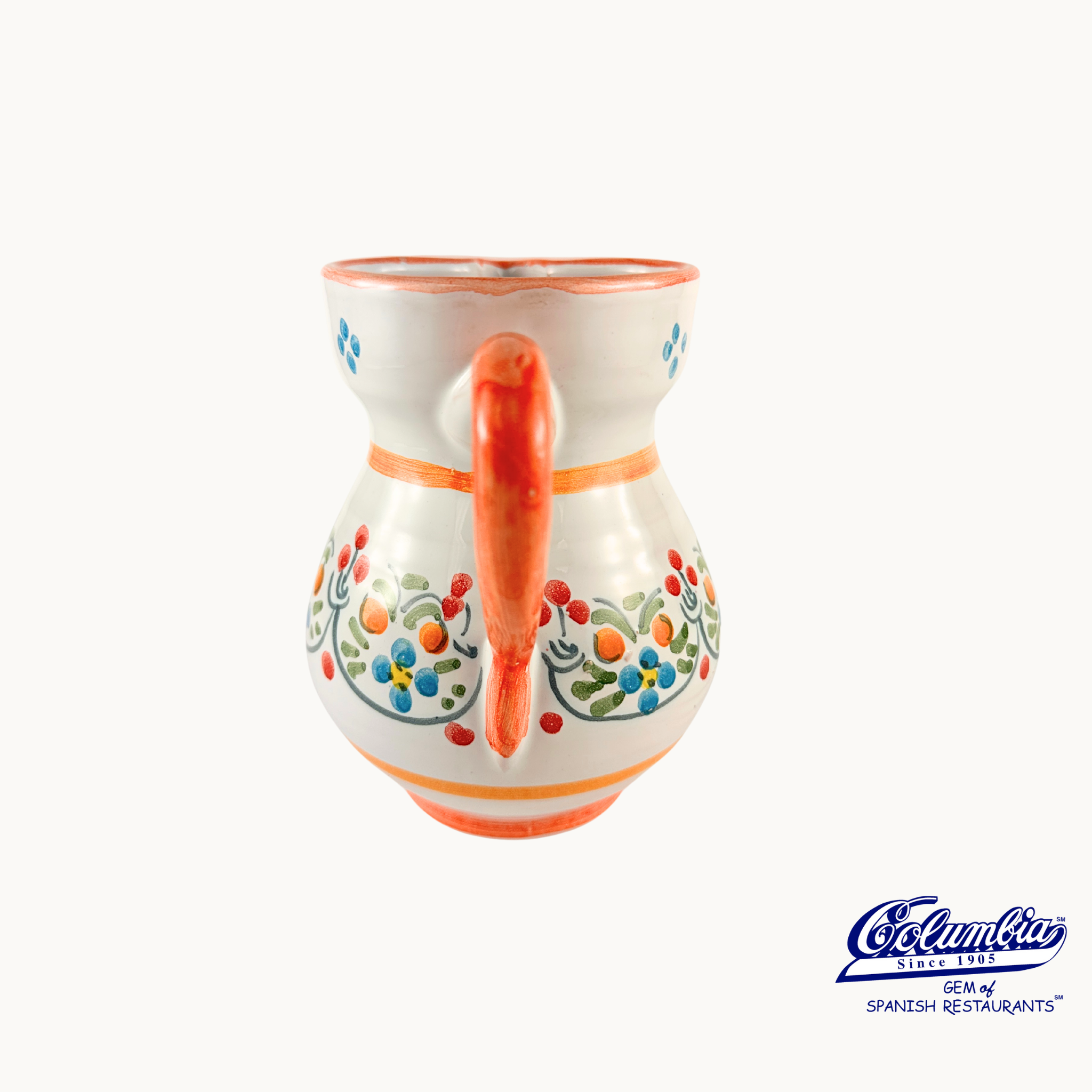 Decorative ceramic pitcher with colorful floral patterns on a white background, featuring the Columbia logo.