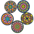A set of five colorful ceramic coasters with geometric patterns.